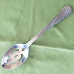 Gibson Stainless Caprice Pattern Pierced Serving Spoon 18/0 China 3/8". Fixed Price $9.99.