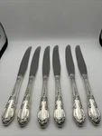 6 Dinner Knives Oneida Enchantment 1881 Rogers Silverplate. Fixed Price $17.00.
