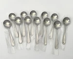 12 Oneida Bouillon Soup Spoons Stainless 1880 Flight Round New Dozen. Fixed Price $54.00.