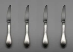Set Of Four - Reed & Barton Stainless Hammered Antique Dinner Knives New. Fixed Price $24.99.