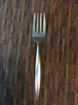 Ekco Stainless Usa EKS36 Salad Fork Glossy Stamped Plain Handle Raised Center. Fixed Price $7.00.