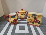 Oneida Kitchen Sunset Bouquet Ceramic Covered Sugar, Creamer, & Napkin. Fixed Price $19.99.