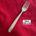 Silco INS-125 Swirls Slanted Tip Dinner Fork 7" Stainless Steel Flatware. Fixed Price $6.62.