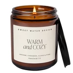 Sweet Water Decor Warm Cozy Soy Candle - Orange Peel, Tan Label, Amber. Fixed Price $32.99.