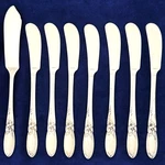 8 White Orchid Oneida Butter Knives 1953 Silverplate. Fixed Price $22.00.